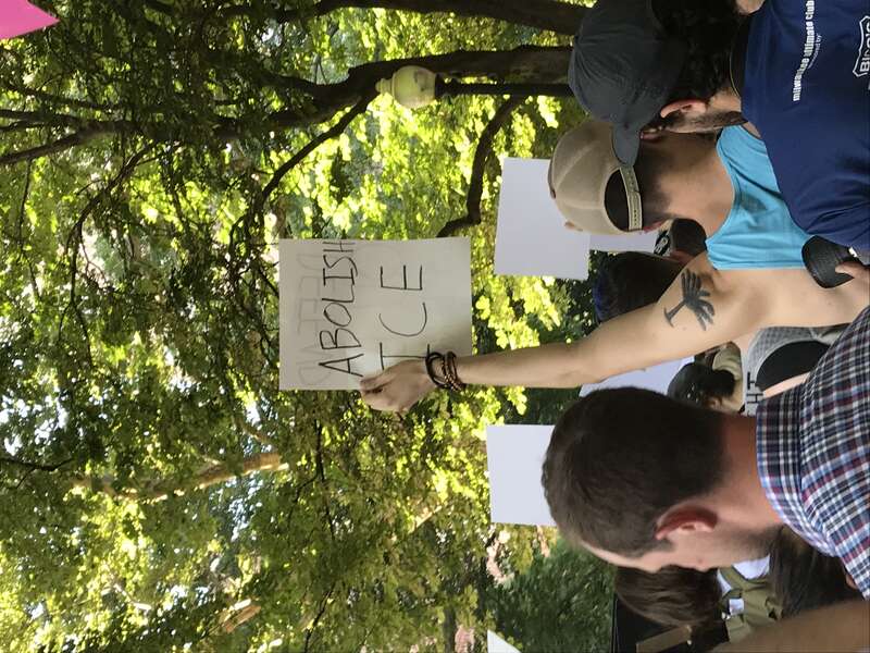 A protester holding a sign that says &quot;abolish ICE&quot; at a protest against immigration and customs enforcement (ICE) in Philadelphia. The protest was specifically against the Trump Administration's &quot;zero tolerance&quot; policy separating children and parents