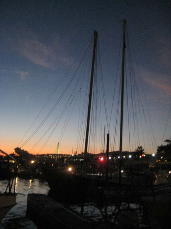 View of the American Spirit schooner docked at Gangplank Marina in Washington, D.C. The Washington Monument is in the background.