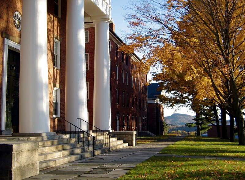Southern portion of College Row on the Amherst College campus. Front steps of Johnson Chapel are shown in foreground, with South and Appleton Halls, both first-year dormitories, and the Holyoke Range visible in the distance.