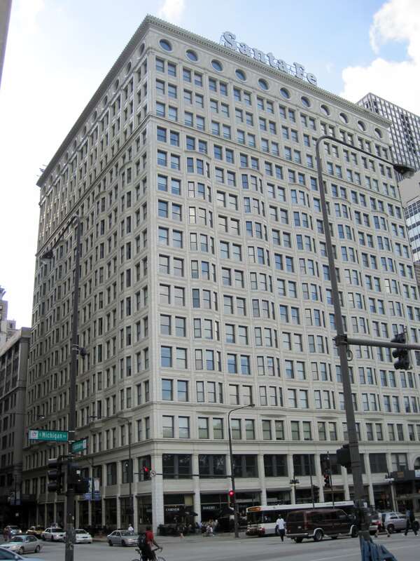 The Railway Exchange Building in Chicago (1904). It was designed by D. H. Burnham &amp;amp; Co. for Burnham. He leased it to the Atchison, Topeka and Santa Fe Railway. Burnham used a suite on the top floor of his building when he was designing the 1909