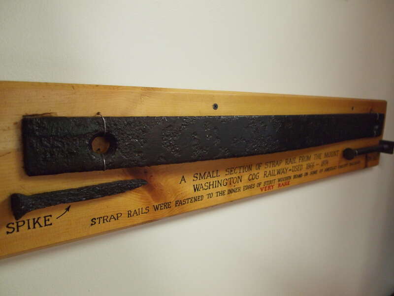 A section of strap rail used in the early Cog Railway at Mt. Washington between 1866 and 1874. Spikes are used to fasten the strap rails to the timbers.