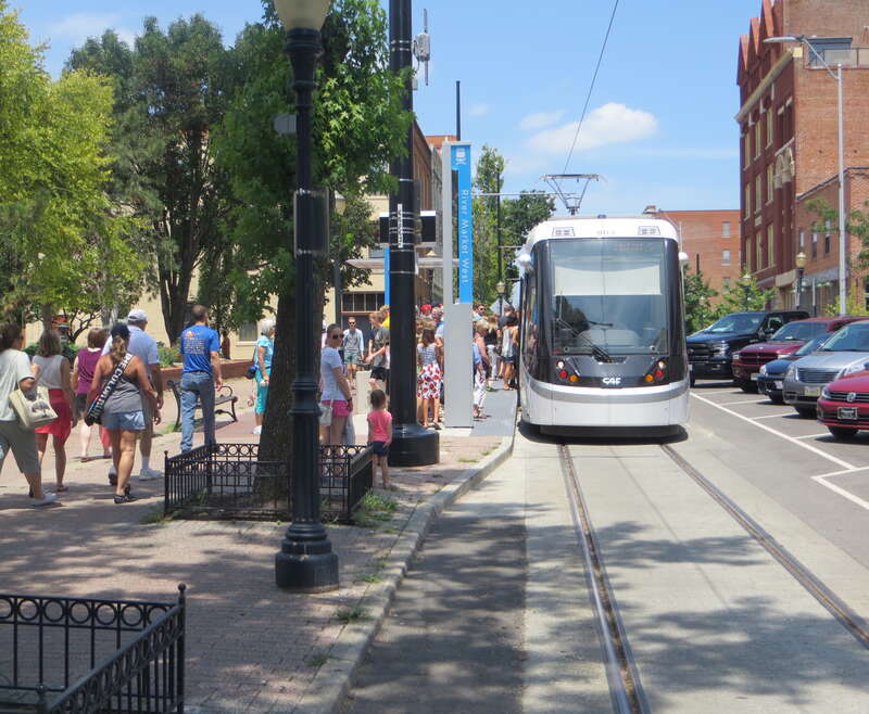 People boarding streetcar in River Market