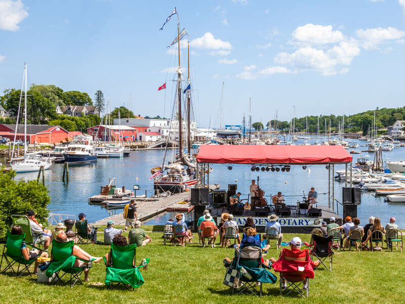 A concert by the harbor in Camden, Main on the Fourth of July.  Playing  what is sometimes called Gypsy Jazz is the Mes Amis Quartet.  This style originated in France in the 1930s with the most famous band being Quintette du Hot Club de France