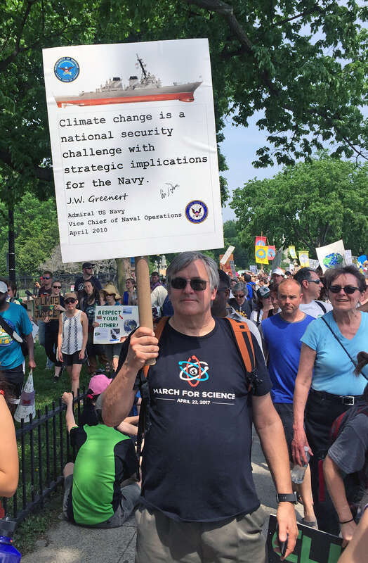 Photos of people, banners, and signs at the People's Climate March on April 29, 2017, in Washington, DC.