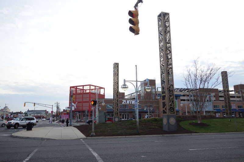 Looking north along the promenade of Christopher Columbus Boulevard across from Columbus Plaza within the Tanger Outlets The Walk complex, at Arctic Avenue and Christopher Columbus Boulevard / Arkansas Avenue in Atlantic City, New Jersey. Note that