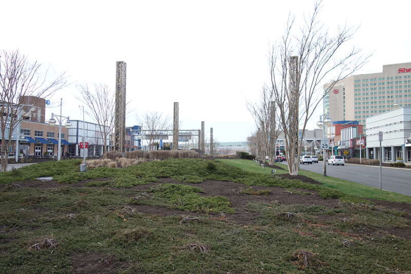 Looking north along the promenade of Christopher Columbus Boulevard across from Columbus Plaza within the Tanger Outlets The Walk complex, at Arctic Avenue and Christopher Columbus Boulevard / Arkansas Avenue in Atlantic City, New Jersey. Note that