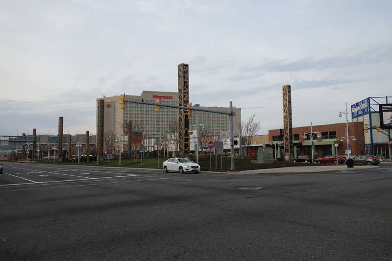 Looking north along the promenade of Christopher Columbus Boulevard across from Columbus Plaza within the Tanger Outlets The Walk complex, at Arctic Avenue and Christopher Columbus Boulevard / Arkansas Avenue in Atlantic City, New Jersey. Note that