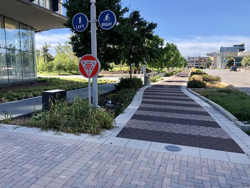 Image of the Indianapolis Cultural Trail in Indianapolis, Indiana, United States. The photo was captured from the southeast corner of the Alabama and Market street intersection in downtown Indianapolis.
This is a segment of the trail where