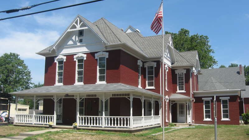 Front and eastern side of the J.W. Patterson House, located at 203 E. Washington Street in Fairmount, Indiana, United States.  Built in 1888 and since converted into the local historical society museum, it is listed on the National Register of