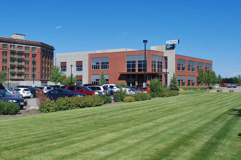 Photo of the Spokane Technology Center building in August 2013 under its Innovate Washington banner.  The building was developed in 2005 by the Spokane Intercollegiate Research &amp;amp; Technology Institute (SIRTI), one of the predecessor agencies that