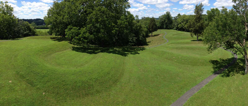 This image was taken in July, 2013, and shows the entirety of The Great Serpent Mound located near Peebles, Ohio, United States. From left, the image shows the serpent's triple-coiled tail, follows its writhing body northward and ends at the effigy's