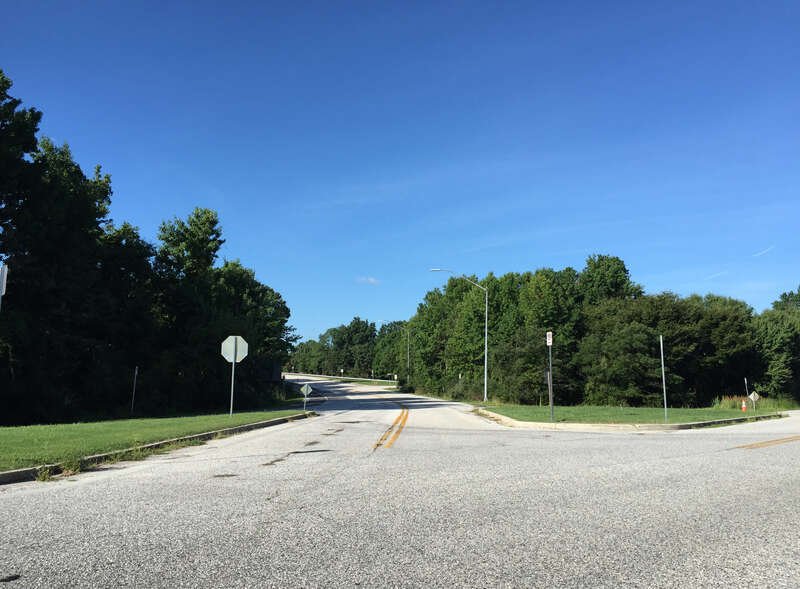 View south along Maryland State Route 908 (Oceanic Drive) at College Parkway in Skidmore, Anne Arundel County, Maryland