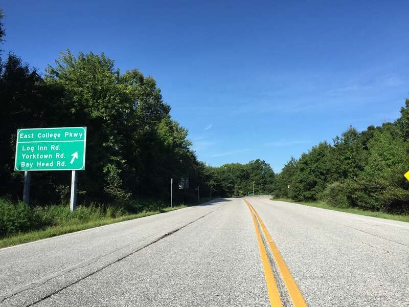 View west along Maryland State Route 908 (College Parkway) just west of the ramp to U.S. Route 50 west and U.S. Route 301 south (Blue Star Memorial Highway) in Skidmore, Anne Arundel County, Maryland
