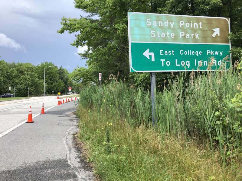 View north along Maryland State Route 908 (Oceanic Drive) at the exit for Sandy Point State Park in Skidmore, Anne Arundel County, Maryland