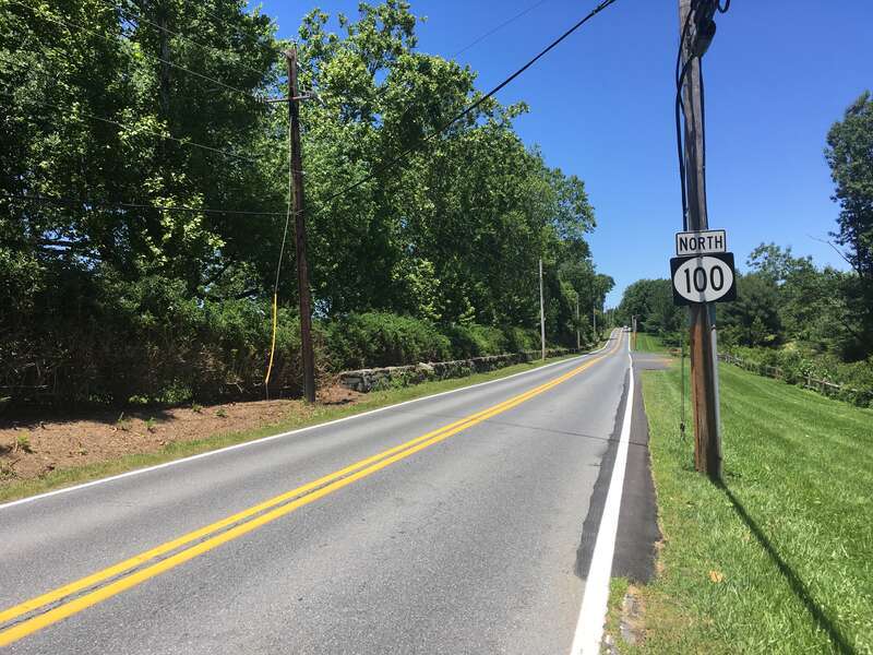 Northbound Delaware Route 100 (Montchanin Road) past the intersection with Kirk Road in Montchanin, Delaware