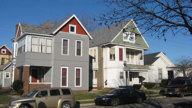 Houses on the northern side of the 400 block of E. Gilbert Street in Muncie, Indiana, United States.  From left to right, they were built in 1900, 1885, and 1880.  This block is part of the Goldsmith C. Gilbert Historic District, a historic district