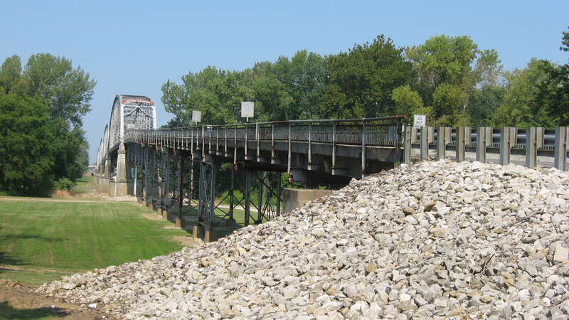 Southern side of the eastern end of the Harmony Way Bridge, which carries Indiana State Road 66 and Illinois Route 14 over the Wabash River between New Harmony, Indiana and rural White County, Illinois in the United States.  Built in 1930, it is