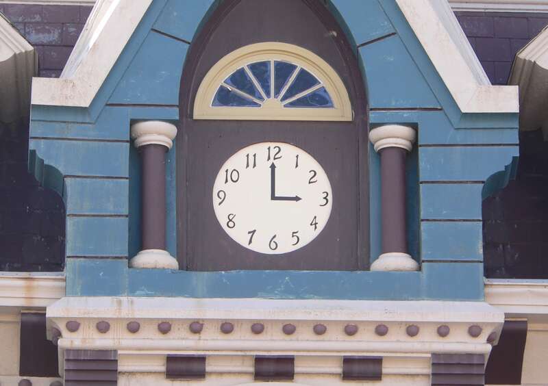Detail of east (front) side of J. Schmuck Block, located at 113 N. 5th Street in Beatrice, Nebraska.  Note that clock is painted on building.