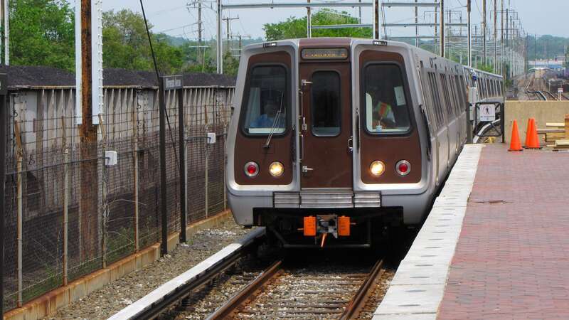 A train, led by a car 6110, arrives at Minnesota Avenue station on its way to New Carrollton.

Ben Schumin is a professional photographer who captures the intricacies of daily life.  This image may be used under Creative Commons