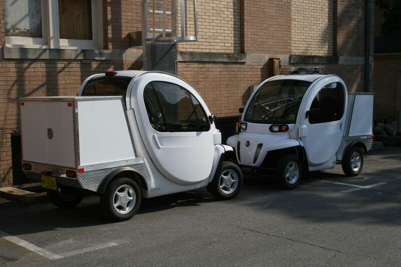 A pair of GEM electric cars at UNC.