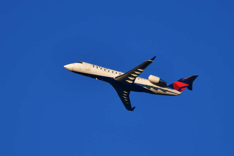 An airplane passes over Lake Harriet on its way from Minneapolis-St. Paul International Airport.