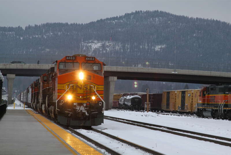 An eastbound BNSF manifest freight rolls past the Amtrak platform into Whitefish Yard on the last day of 2012