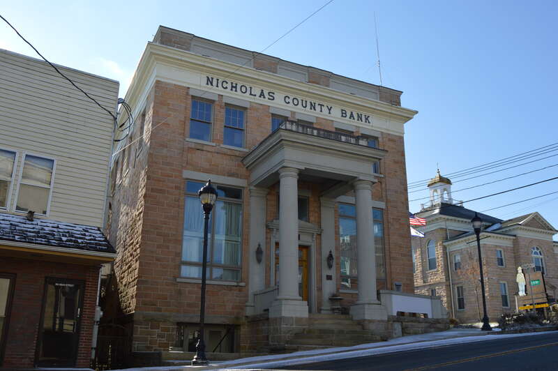 Front and eastern side of the Nicholas County Bank, located at 800 Main Street (West Virginia Route 41) in Summersville, West Virginia, United States.  Built in 1923, it is listed on the National Register of Historic Places.  The Nicholas County
