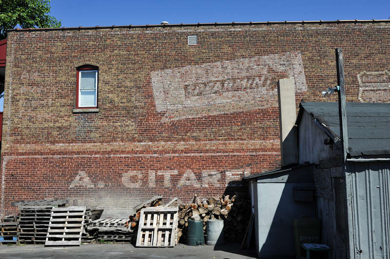 Old Wrigley's Spearmint Gum sign on old building.