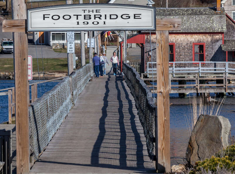 This wooden footbridge extends across the harbor in Boothbay Harbor, Maine. HFF