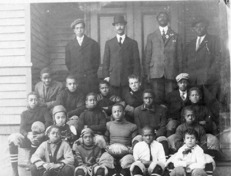 YMCA Football team, champions in 1908, on the steps of the Witherspoon School on the corner of Witherspoon and Maclean Streets.
Several of those pictured are identified on the verso. Back row: Eddie [Edward] Moore; Professor Thompson, the principal