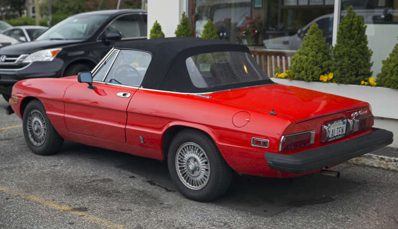 A 1979 Alfa Romeo Spider 2000 Iniezione (US market car, tipo 115.41). It was crashed at some time in the 1980s and fitted with a more modern front bumper, hence no front view. 200,800 miles, passed CA smog back in October 2018. A healthy car, it