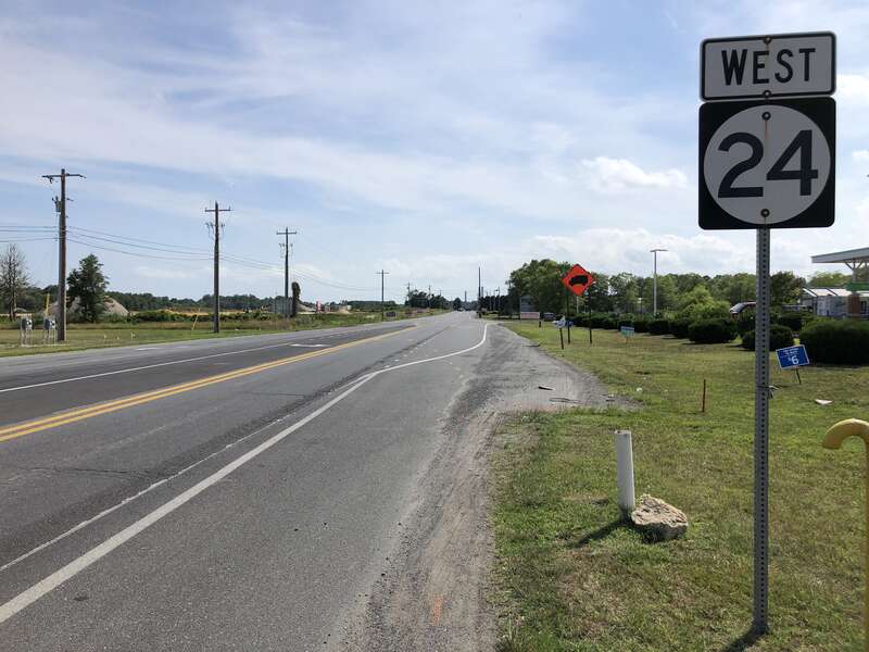 View west along Delaware State Route 24 (John J Williams Highway) at Delaware State Route 5 (Oak Orchard Road) in Harmon, Sussex County, Delaware