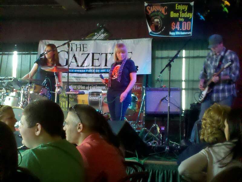 Singer-songwriter Erin Harkes singing with Albany, NY-based band Sirsy at WILDWOODstock — a benefit for the Wildwood School (Schenectady, NY) for autistic children — at The Parting Glass in Saratoga Springs, NY.