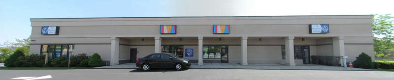 Front view of the 1958-built Salem station on Margin Street. After the MBTA built a new station north of the tunnel with increased parking, this building has had various uses. A 2003 renovation covered the original brick exterior. At the time of this
