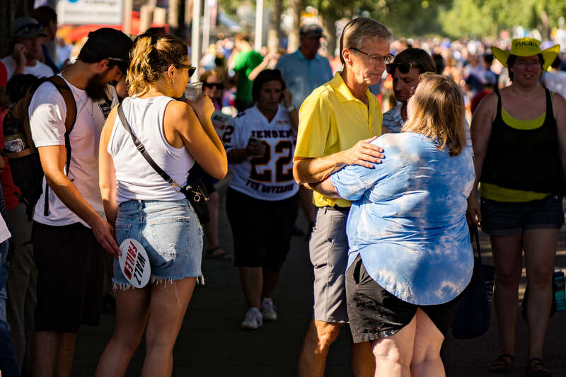 Scott Jensen, Republican candidate for Minnesota Governor, speaks to a supporter at the Minnesota State Fair.