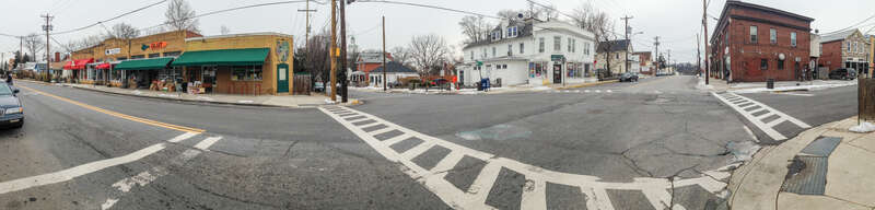 Panorama of the Glut, tan brick building with green awning, and the neighborhood they serve in Mount Rainier, Maryland, on Tuesday, March 3, 2015. Glut is a worker owned cooperative store that was founded in 1961. Its motto is &quot;Still Cheap, Still