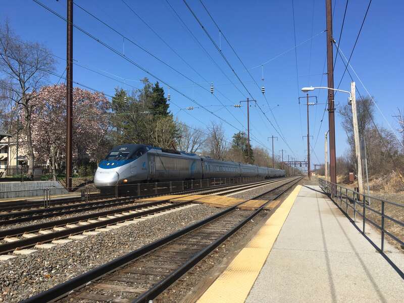 Amtrak Acela Express power car 2002 leads a southbound Acela Express train bound for Washington, D.C. through Newark station in Newark, Delaware