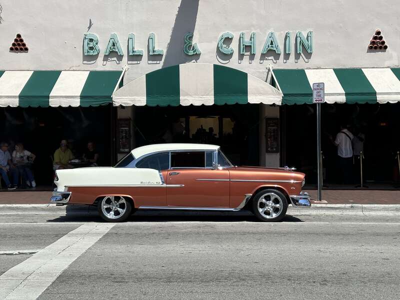 Calle Ocho, Little Havana, Miami, Florida 2024 -  old car parked outside &quot;Ball &amp;amp; Chain&quot;