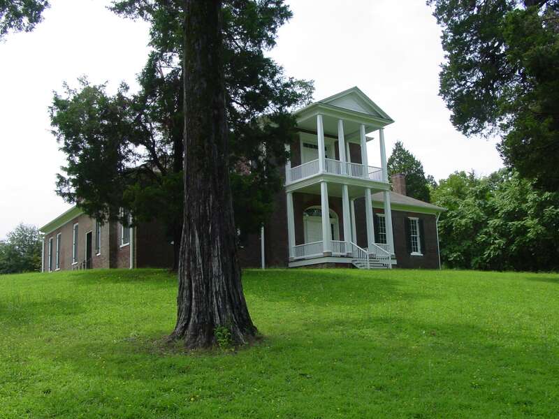Belle Mont historic home with large juniper