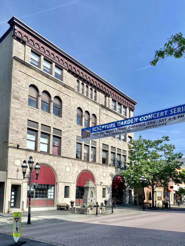 Built in the late 19th Century (appearing on the 1892 Sanborn Fire Insurance Map) this Renaissance Revival-style building was historically the home of the First National Bank of Bethlehem.  The building features a rusticated and smooth stone block