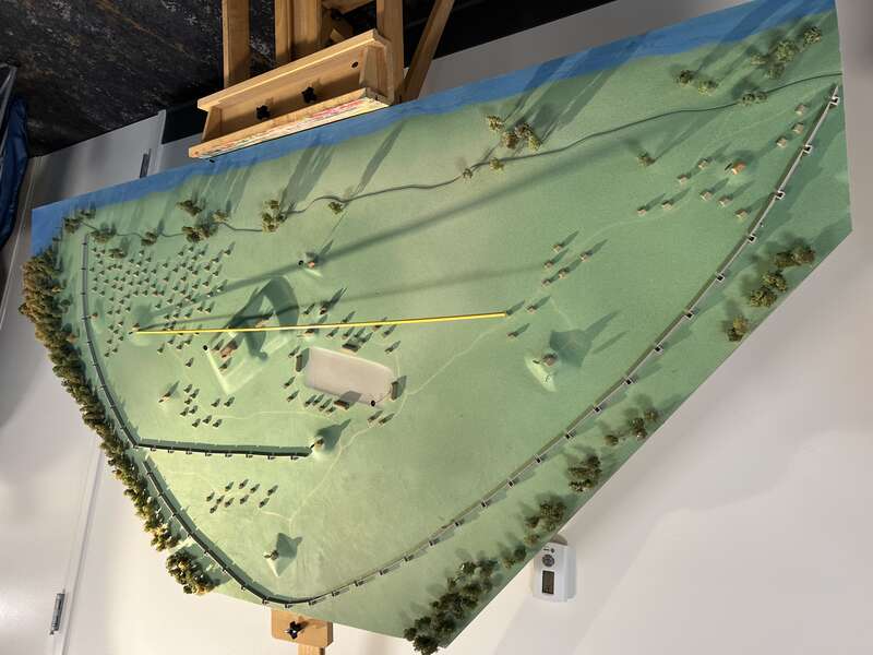 A model of the Angel Mounds State Park at the Angel Mounds State Historic Site visitor center, showing how the site might have looked when last occupied. A yellow line shows how mound B and mound A line up to point towards the winter solstice.
