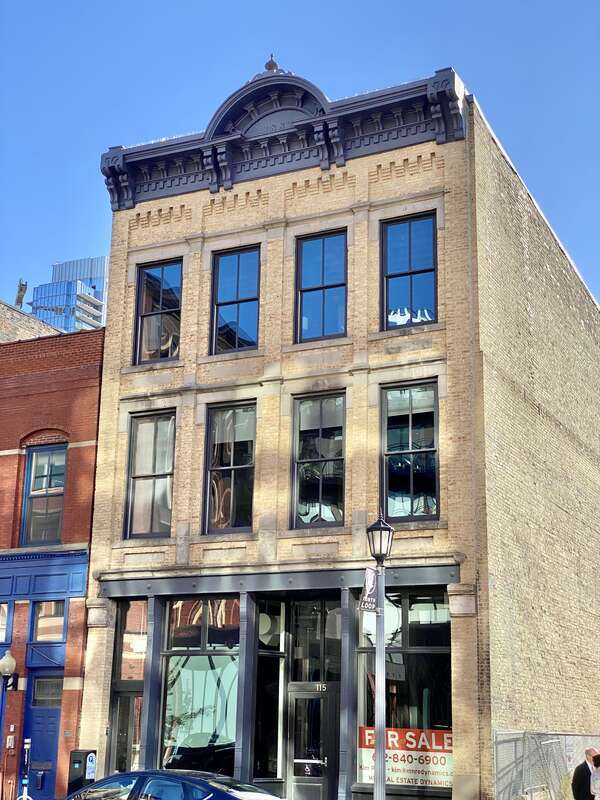 Built in 1883 and 1885, these two brick Italianate-style commercial buildings stand side by side on 1st Street in Minneapolis’s North Loop/Warehouse District.  The building to the south, built in 1885, features a red brick facade with arched second