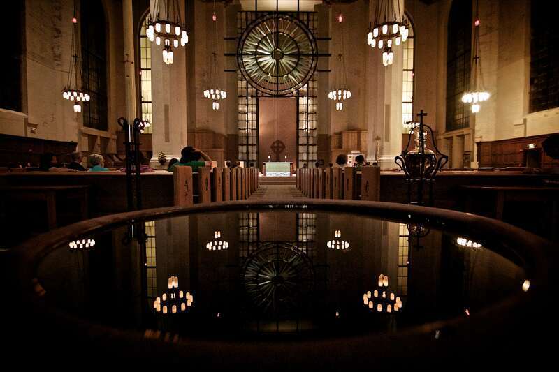 The baptismal font near the sanctuary entrance.