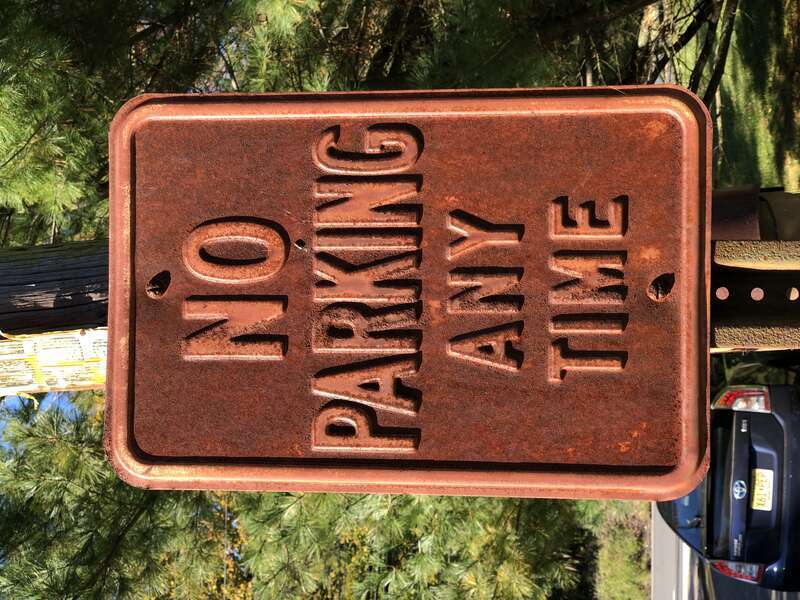 Very old and rusty &quot;No Parking Any Time&quot; sign along westbound Crest Avenue just east of New Jersey State Route 31 (Pennington Road) in Hopewell Township, Mercer County, New Jersey