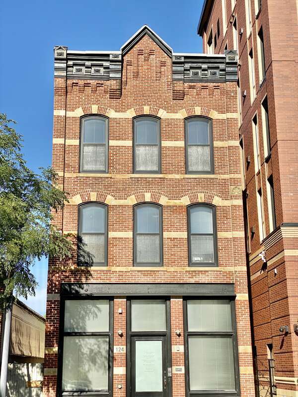 Built in 1884, this Italianate-style building was formerly known as the Chicago House Hotel, a boarding house.  The building features brick pilasters, a decorative stamped metal cornice, arched window openings with decorative stone and brick
