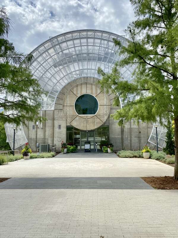 Built in 1983-1985, this Modern building was designed by Conklin and Rossant as part of the construction of the Myriad Botanical Gardens, which began construction in 1971.  The building consists of a large cylinder that is 224 feet (68 meters) long