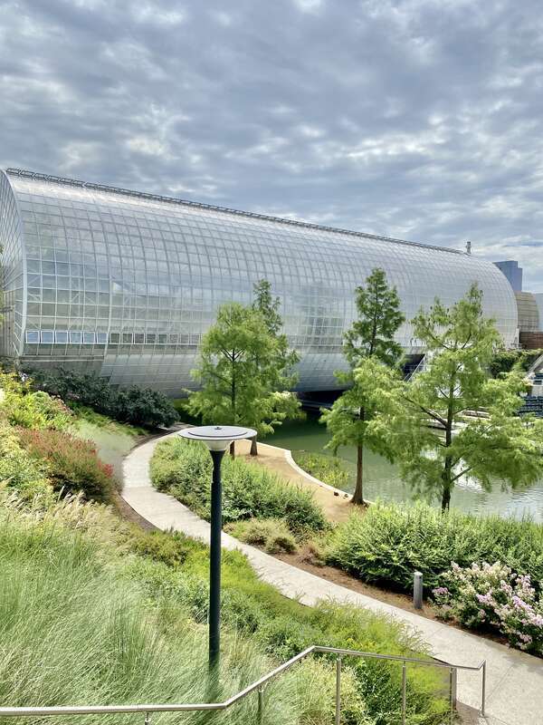 Built in 1983-1985, this Modern building was designed by Conklin and Rossant as part of the construction of the Myriad Botanical Gardens, which began construction in 1971.  The building consists of a large cylinder that is 224 feet (68 meters) long