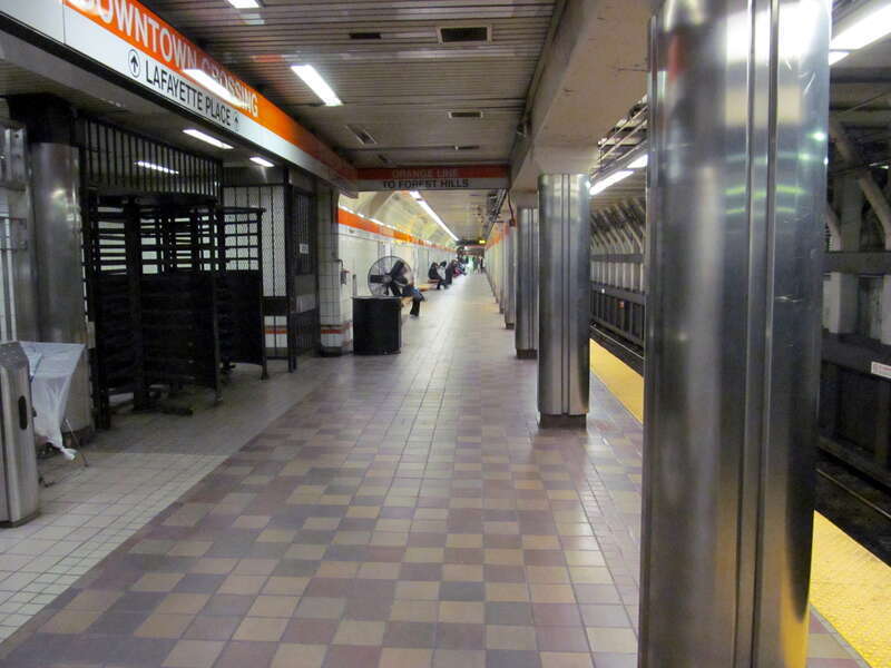 Southbound Orange Line platform and Temple Place entrance (signed for the Lafayette Place mall) at Downtown Crossing station