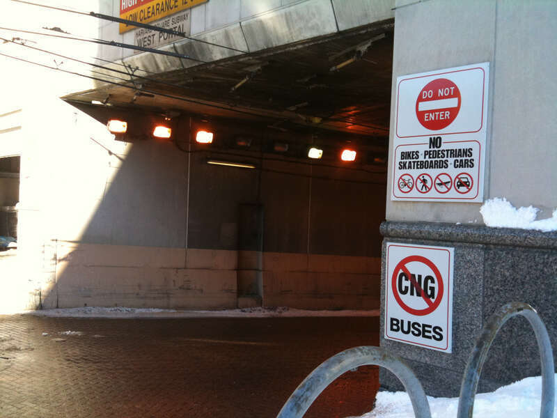 MBTA Harvard Station west portal, with warning signs, in 2010