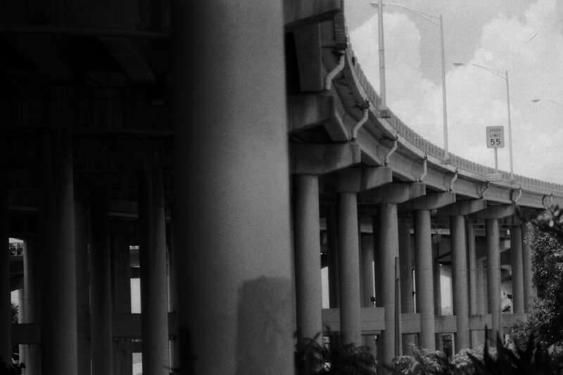 Like a giant caterpillar slamming up earth, the Interstate is about to come to a stop at its southern terminus in Miami. These are the raised overpasses where the movie Scarface was filmed. Photo taken in July of 1994 with my Canon AE-1, its 135mm